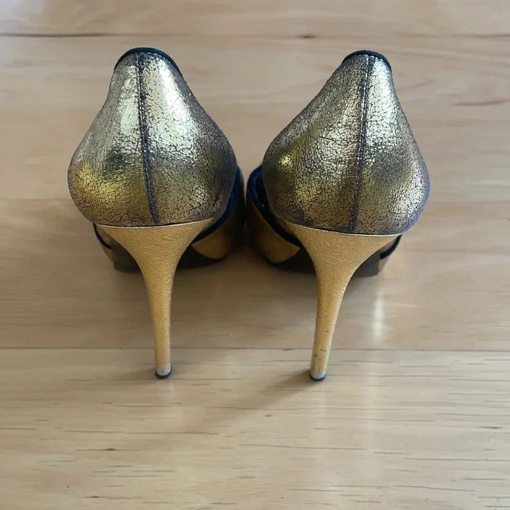 Alexander McQueen gold and black peep toe stilettos